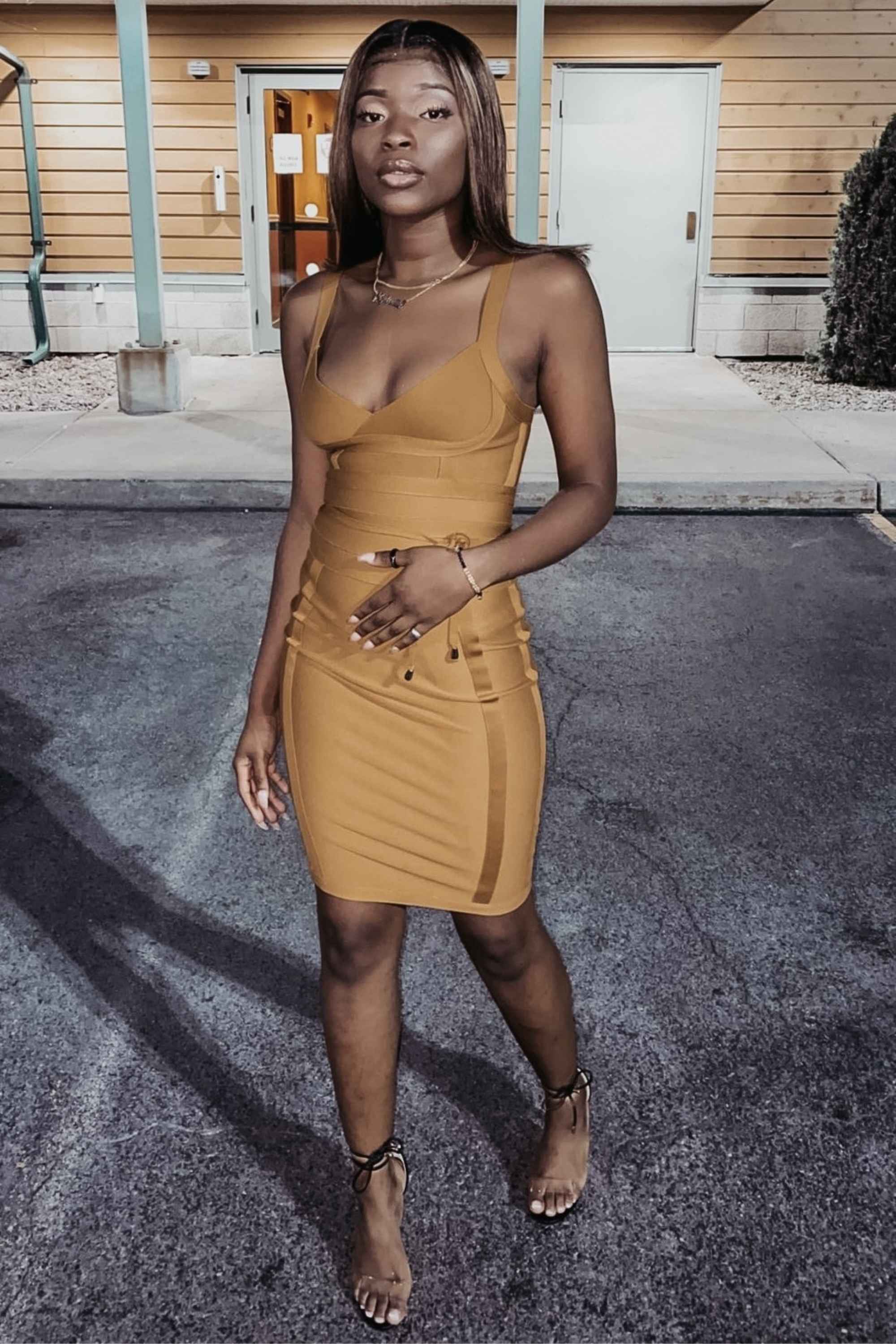 Woman wearing a figure flattering  Bek Bandage Dress - Mustard Yellow Bodycon Collection