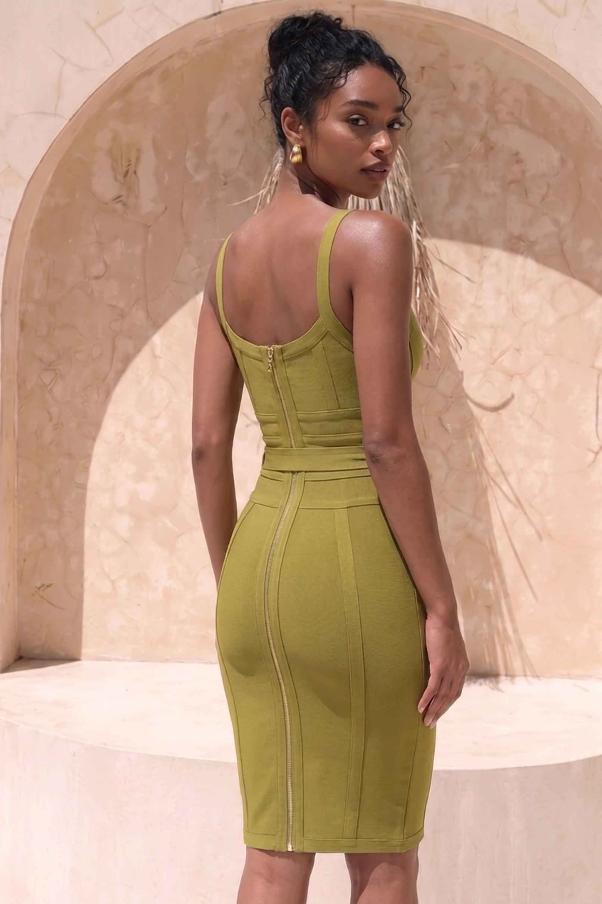 Woman wearing a figure flattering  Bek Bandage Dress - Olive Green Bodycon Collection