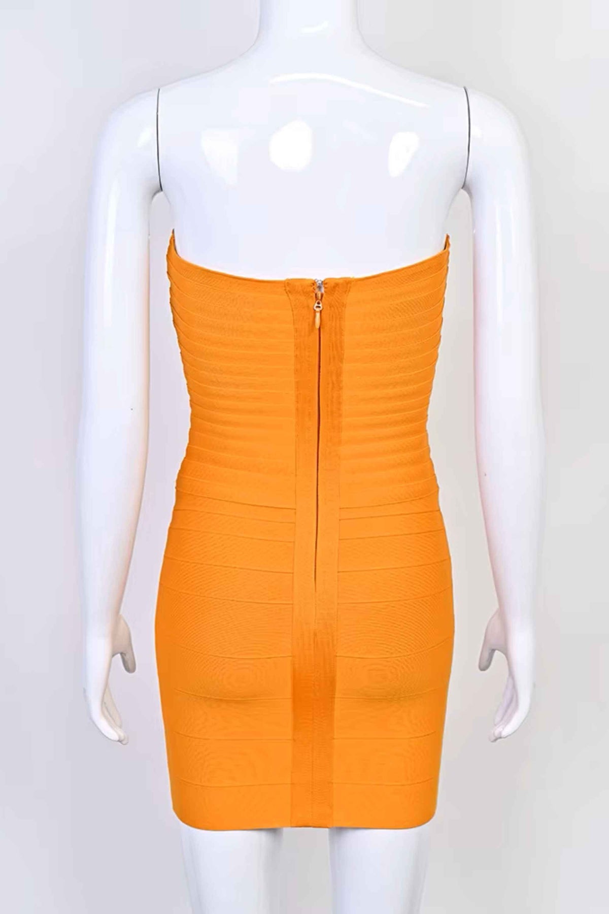 Woman wearing a figure flattering  Belle Bandage Mini Dress - Apricot Orange BODYCON COLLECTION Pty Ltd