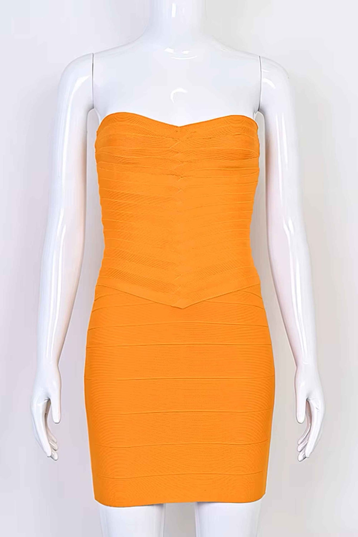 Woman wearing a figure flattering  Belle Bandage Mini Dress - Apricot Orange BODYCON COLLECTION Pty Ltd