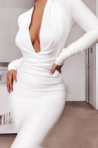 Woman wearing a figure flattering  Blaire Long Sleeve Bandage Dress - Classic Black BODYCON COLLECTION