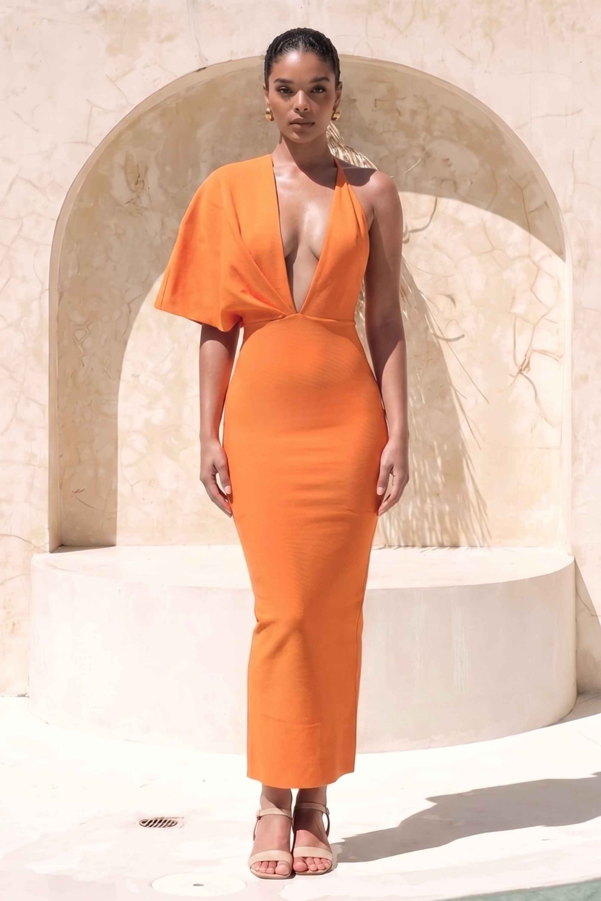 Woman wearing a figure flattering  Blake Bandage Maxi Dress - Apricot Orange BODYCON COLLECTION