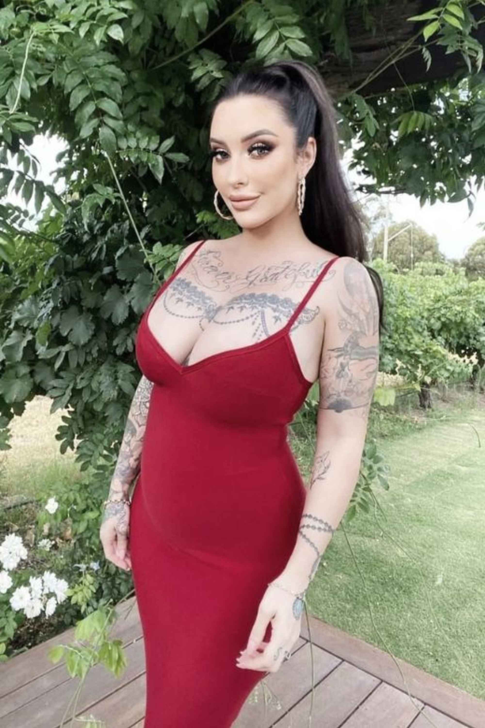 Woman wearing a figure flattering  Blanche Bandage Midi Dress - Lipstick Red BODYCON COLLECTION