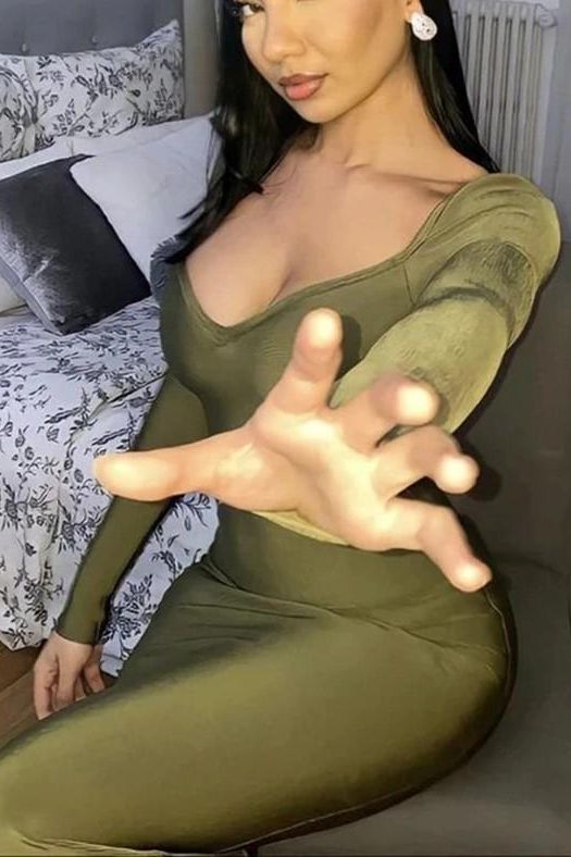 Woman wearing a figure flattering  Blanche Long Sleeve Bandage Midi Dress - Olive Green BODYCON COLLECTION