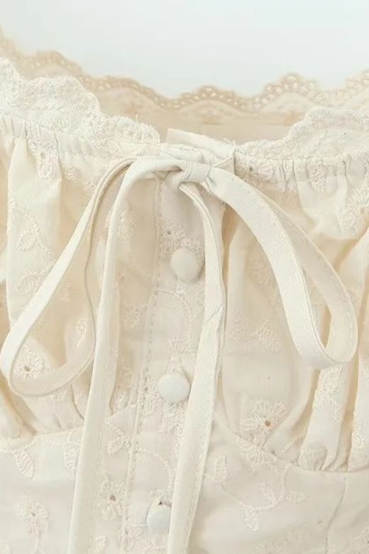 Woman wearing a figure flattering  Cali Wrap Top - Ivory White BODYCON COLLECTION