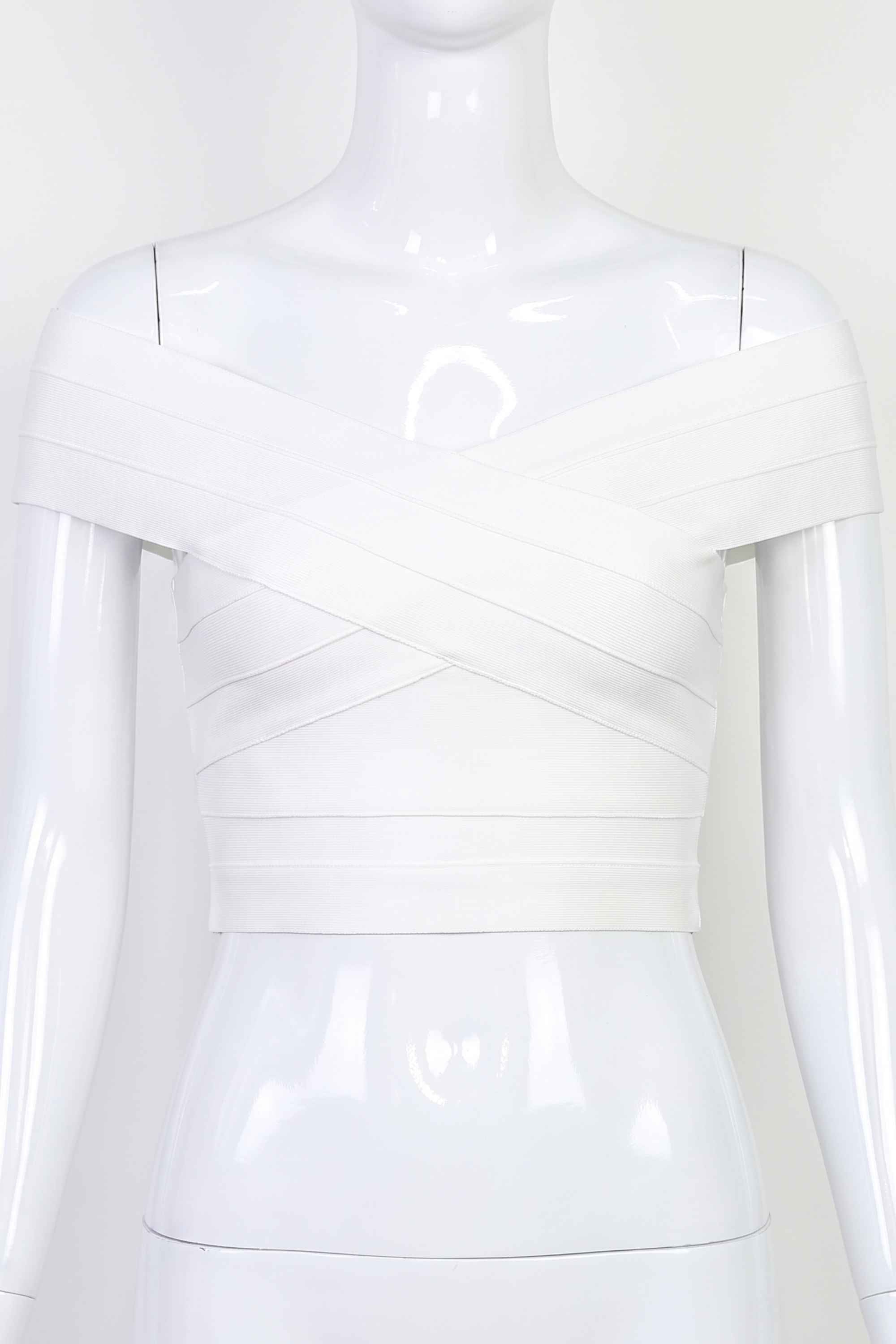 Woman wearing a figure flattering  Cindy Bandage Off Shoulder Crop Top - Pearl White BODYCON COLLECTION