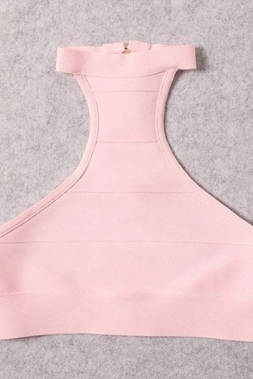 Woman wearing a figure flattering  Elli Bandage Crop Top - Dusty Pink BODYCON COLLECTION