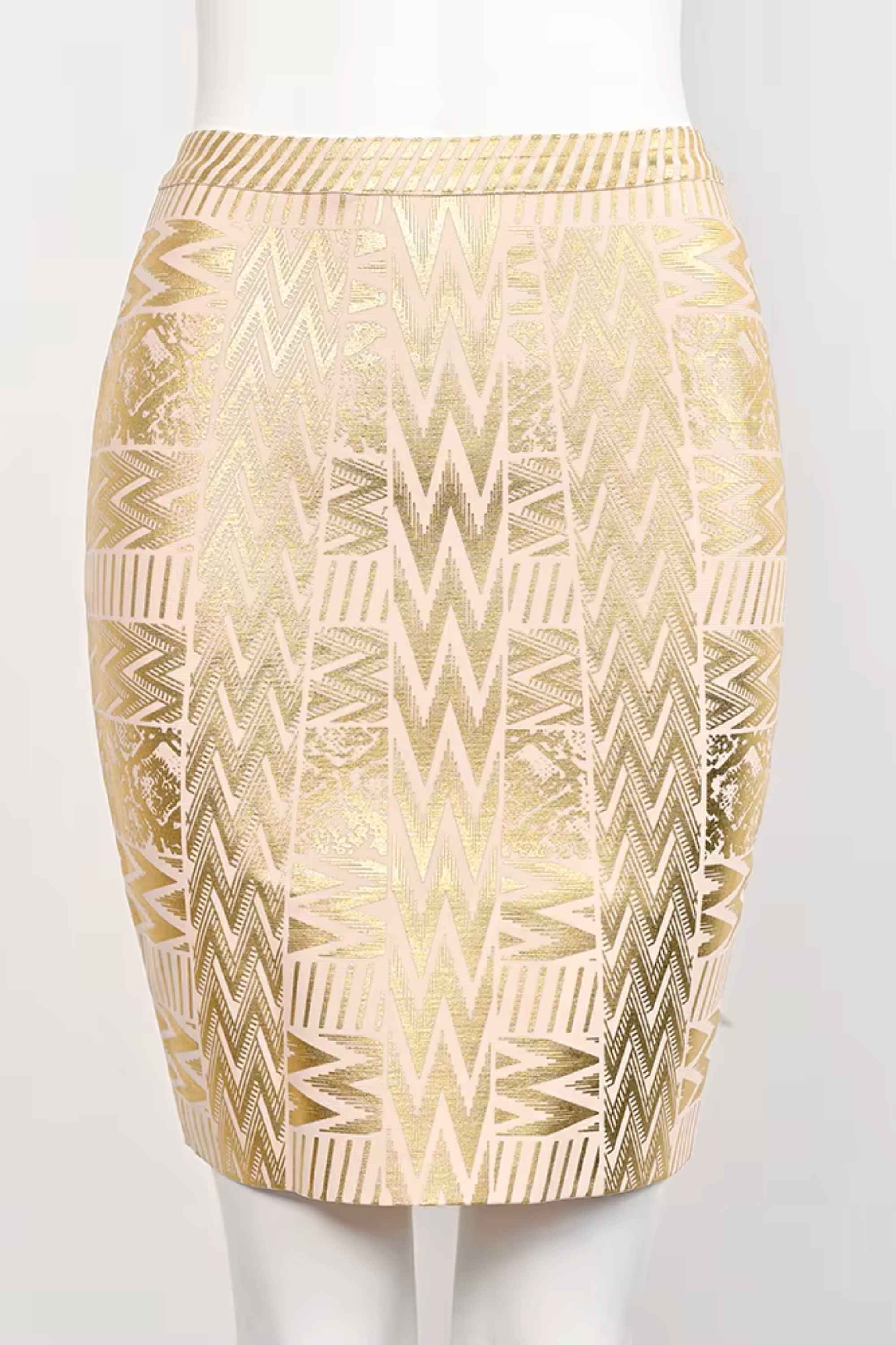 Woman wearing a figure flattering  High Waist Metallic Mini Skirt - Gold BODYCON COLLECTION