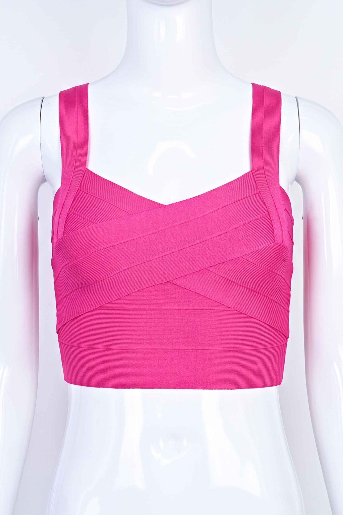 Woman wearing a figure flattering  Jay Bandage Crop Top - Hot Pink BODYCON COLLECTION