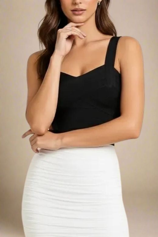 Woman wearing a figure flattering  Jay Bandage Top - Classic Black BODYCON COLLECTION