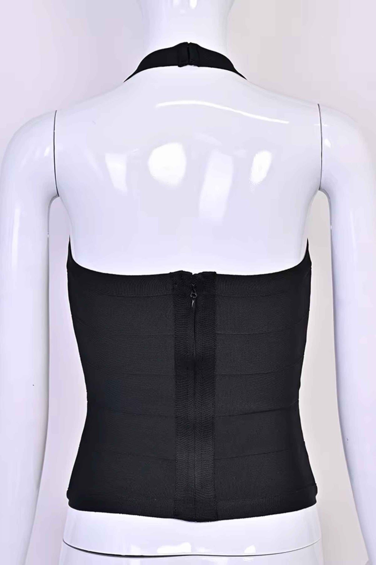 Woman wearing a figure flattering  Jenna Bandage Top - Classic Black BODYCON COLLECTION Pty Ltd