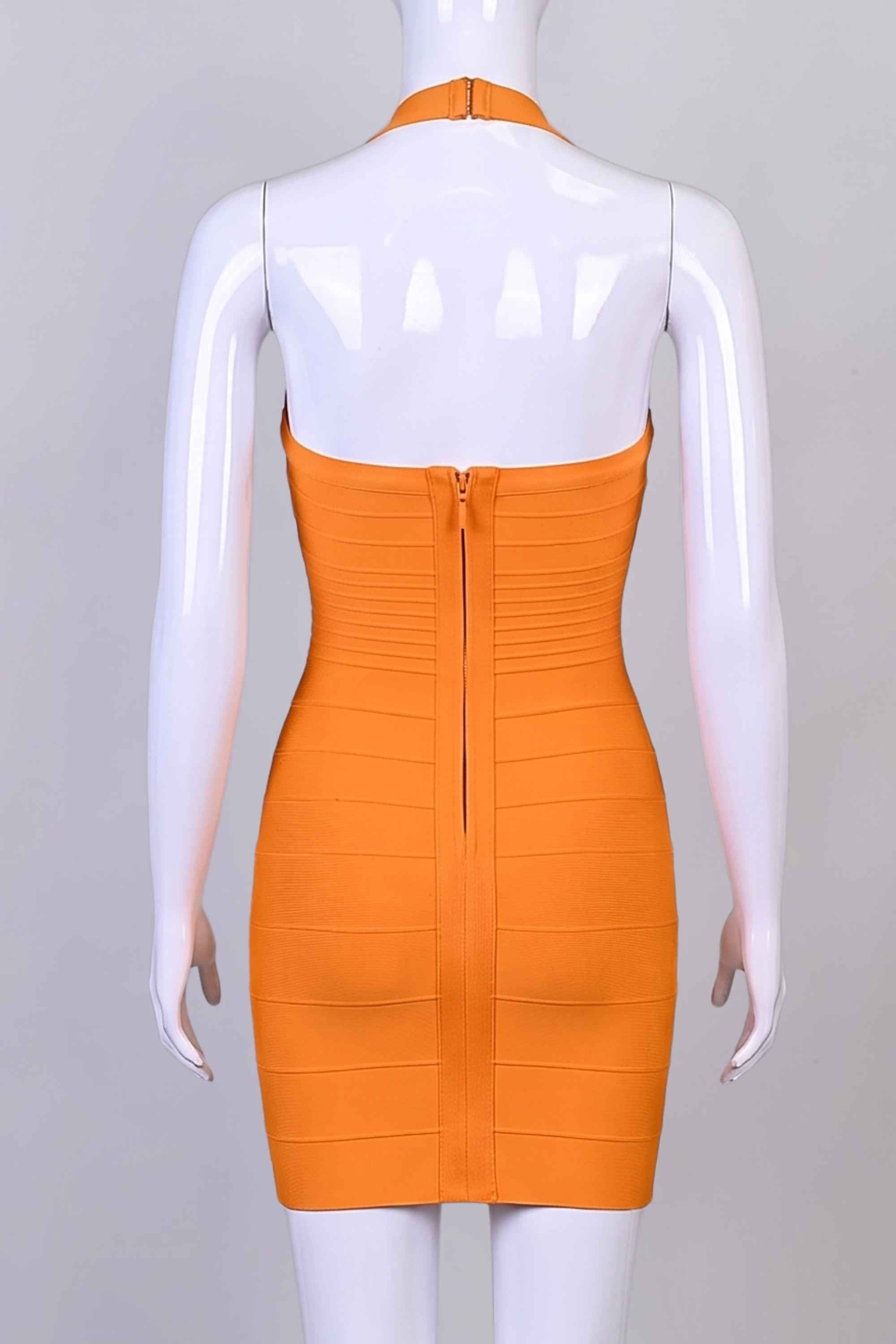 Woman wearing a figure flattering  Kia Bandage Mini Dress - Apricot Orange BODYCON COLLECTION Pty Ltd