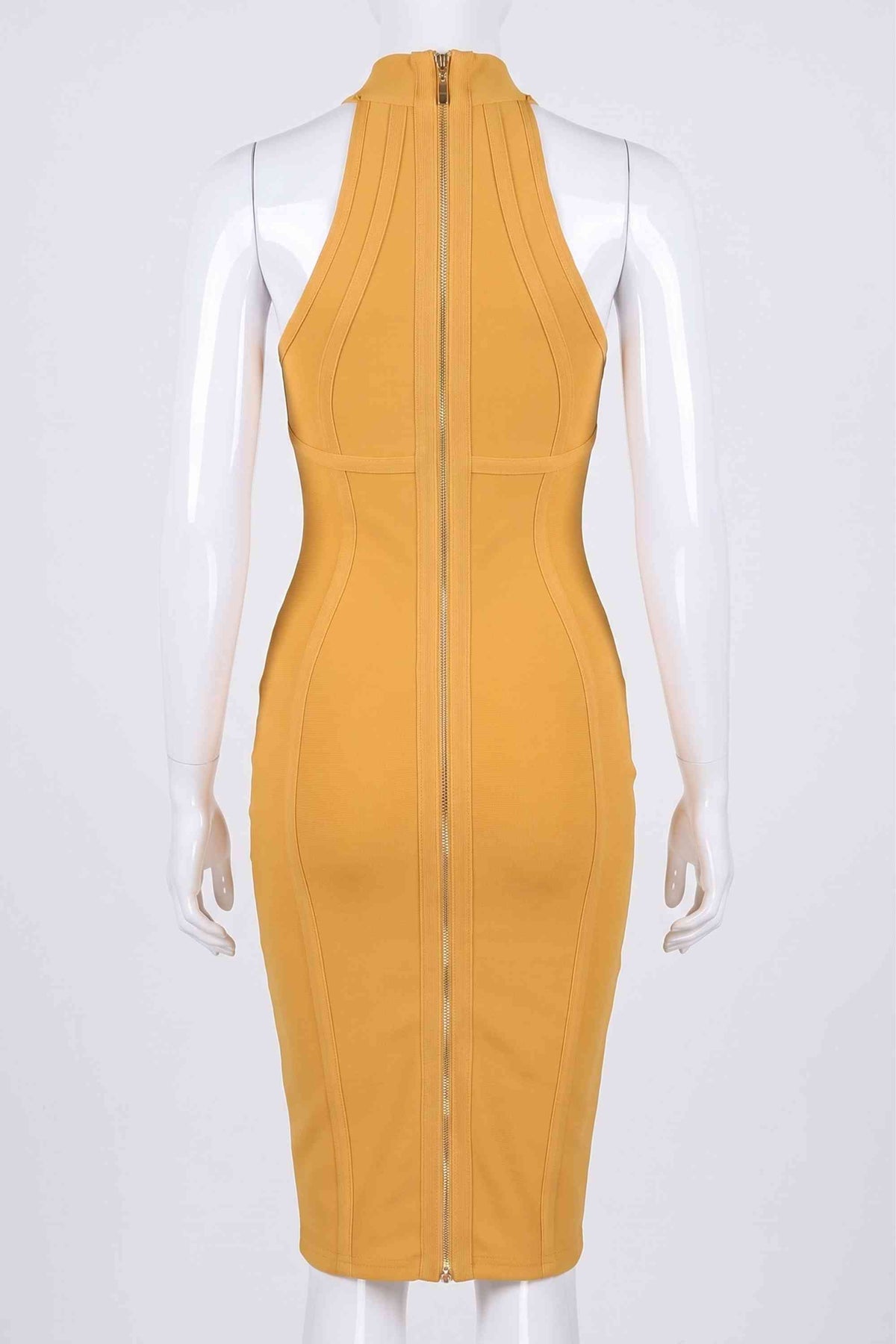 Woman wearing a figure flattering  Lea Bandage Midi Dress - Mustard Yellow Bodycon Collection