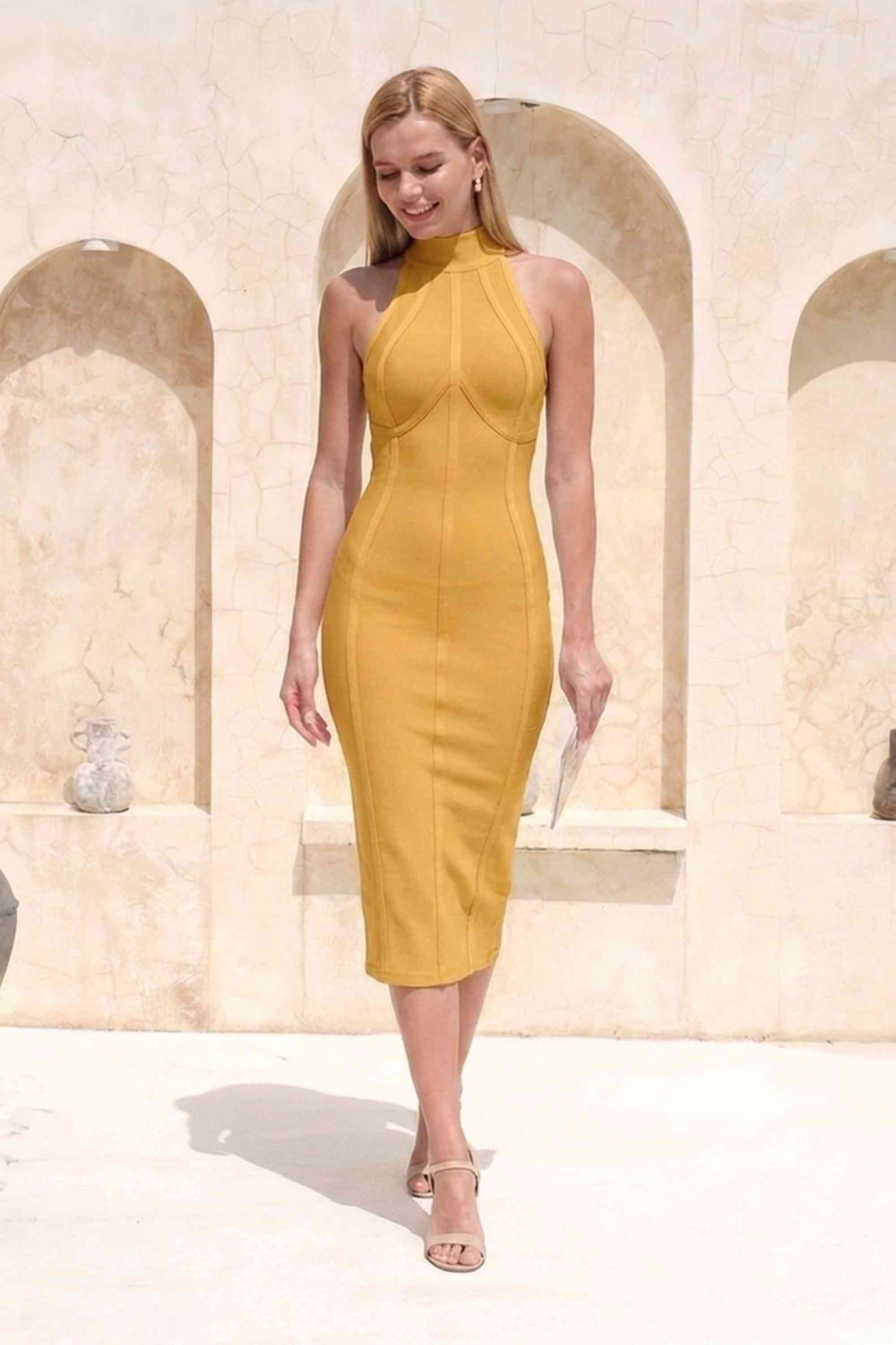 Woman wearing a figure flattering  Lea Bandage Midi Dress - Mustard Yellow Bodycon Collection