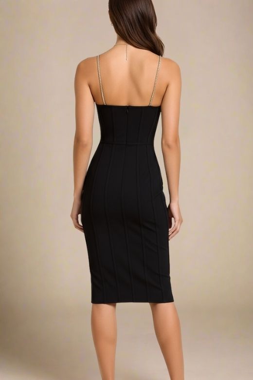 Woman wearing a figure flattering  Leah Bodycon Dress - Classic Black Bodycon Collection