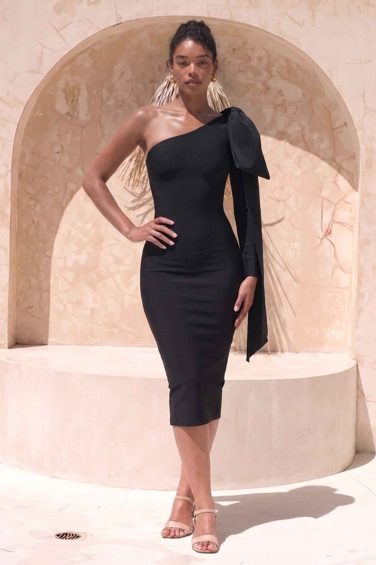 Woman wearing a figure flattering  Lela Long Sleeve Bandage Midi Dress - Classic Black BODYCON COLLECTION