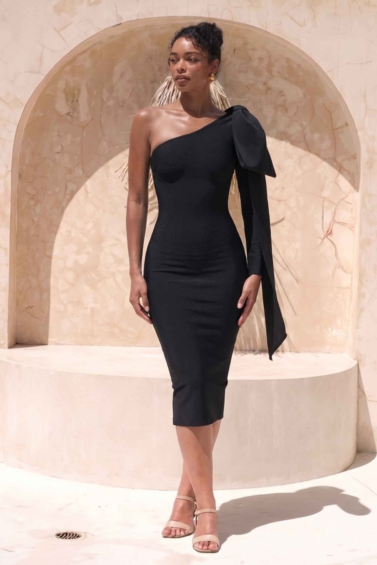 Woman wearing a figure flattering  Lela Long Sleeve Bandage Midi Dress - Classic Black BODYCON COLLECTION