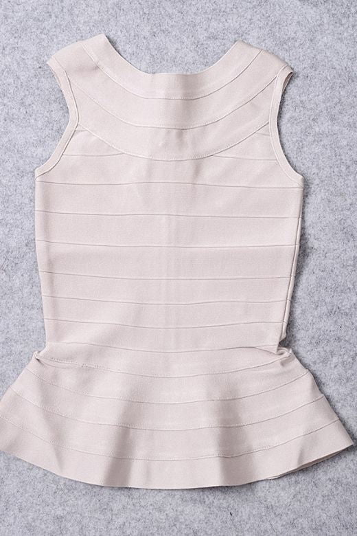 Woman wearing a figure flattering  Leni Bandage Peplum Top - Beige BODYCON COLLECTION