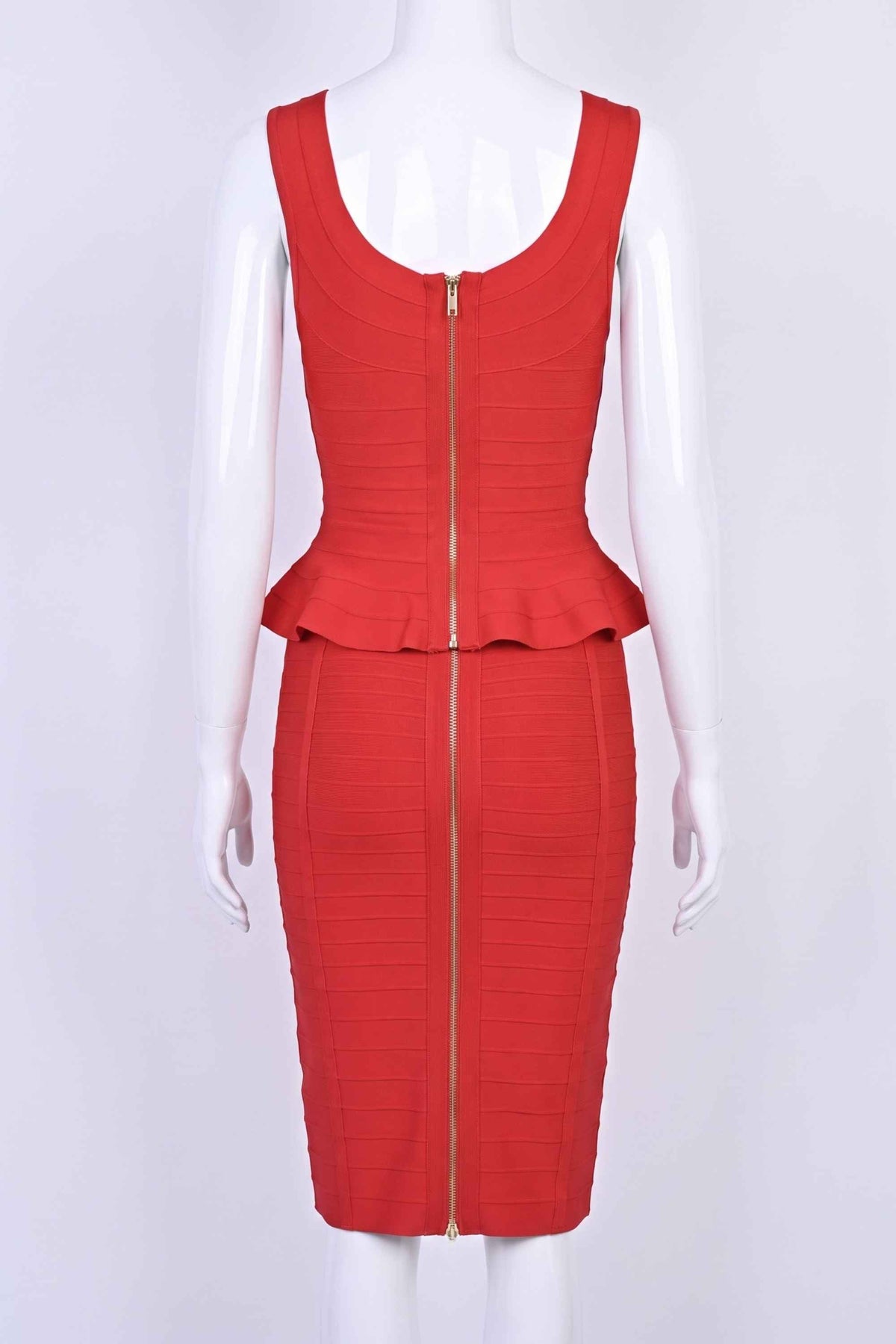 Woman wearing a figure flattering  Leni Bandage Peplum Top - Lipstick Red BODYCON COLLECTION