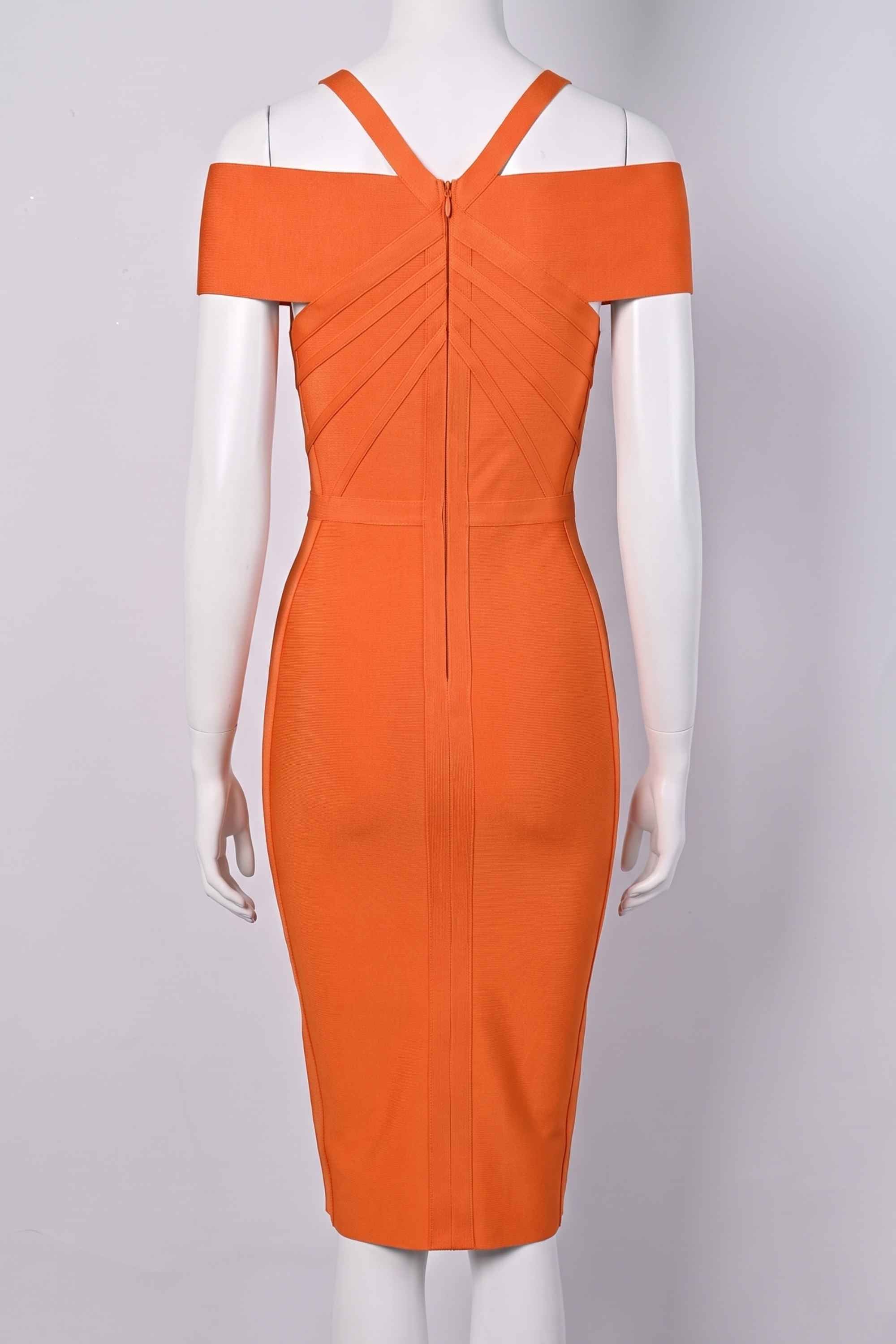 Woman wearing a figure flattering  Leo Bandage Midi Dress - Apricot Orange Bodycon Collection