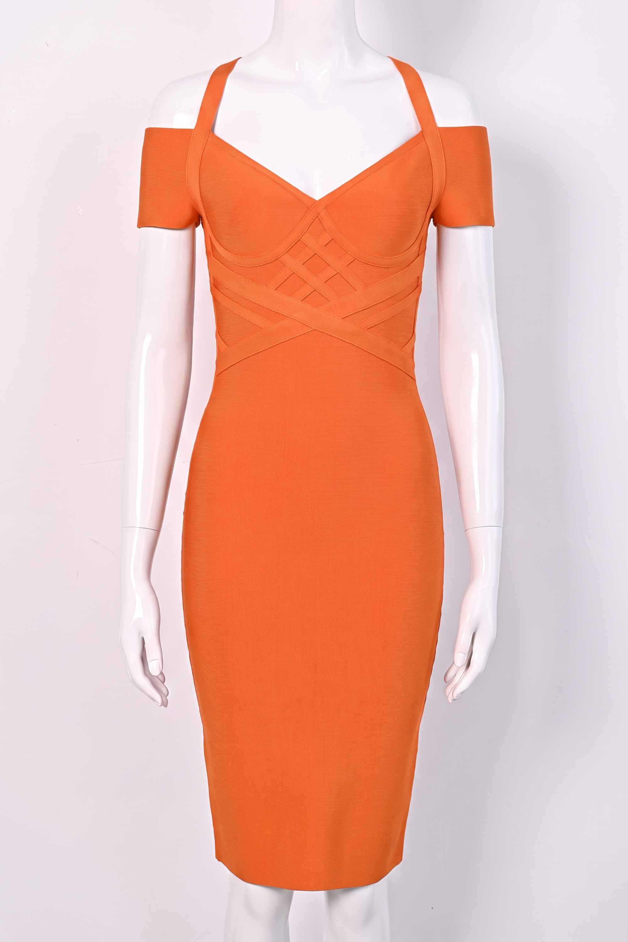 Woman wearing a figure flattering  Leo Bandage Midi Dress - Apricot Orange Bodycon Collection