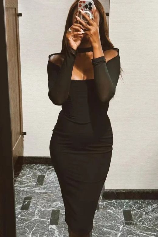 Woman wearing a figure flattering  Lillian Bodycon Midi Dress - Classic Black BODYCON COLLECTION