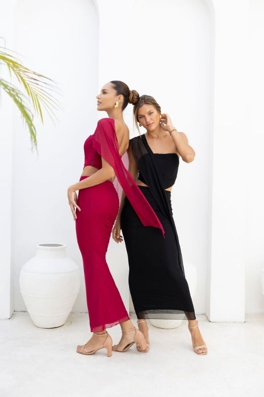 Woman wearing a figure flattering  Margot Wrap Top and Maxi Skirt Outfit Set - Dusty Pink BODYCON COLLECTION