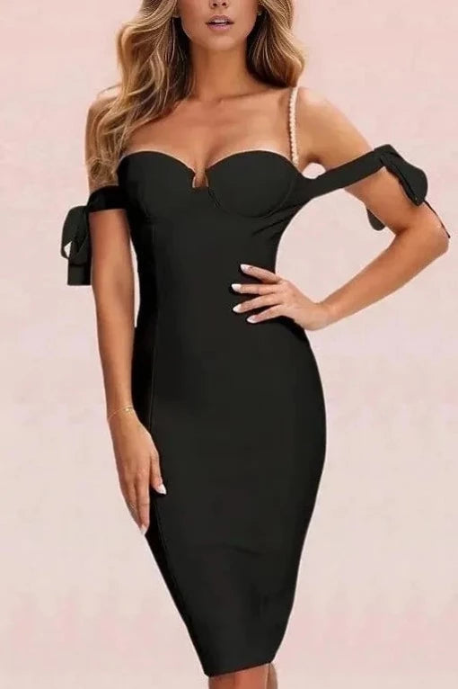 Woman wearing a figure flattering  Mia Bandage Dress - Classic Black BODYCON COLLECTION
