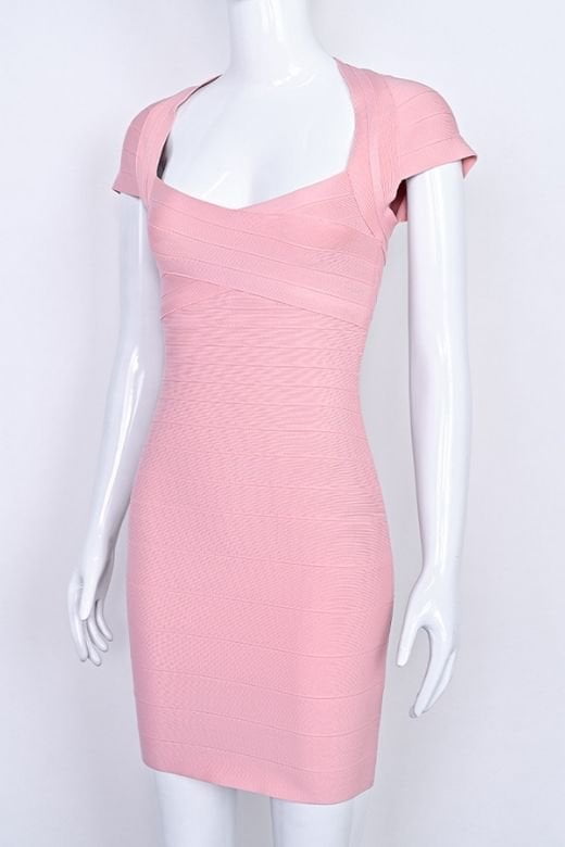 Woman wearing a figure flattering  Miranda Bandage Mini Dress - Ballet Pink Bodycon Collection
