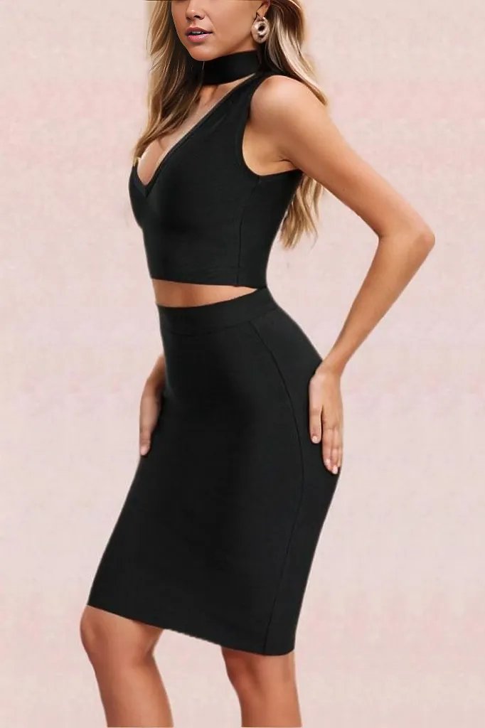 Woman wearing a figure flattering  Misty Bandage Top and Skirt Set - Classic Black BODYCON COLLECTION