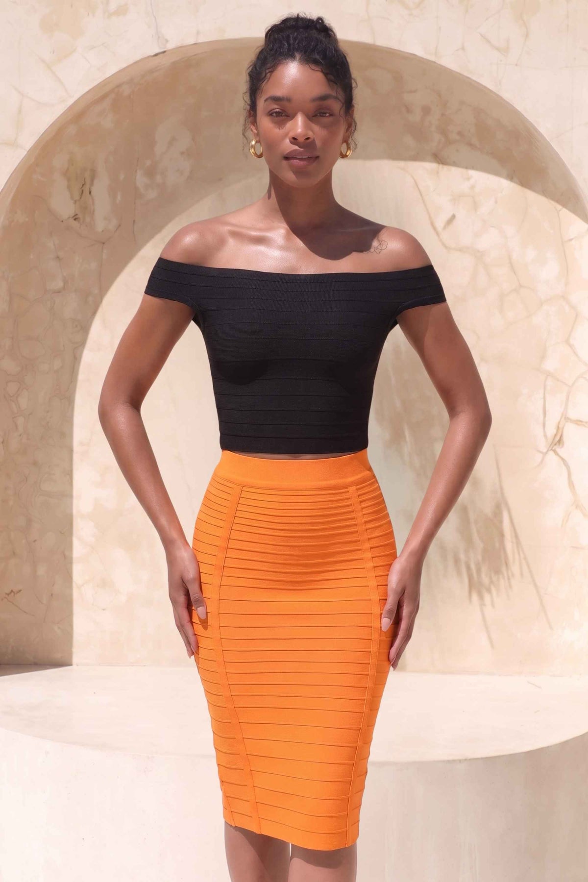 Woman wearing a figure flattering  Pencil High Waist Bandage Knee Length Knitted Skirt - Apricot Orange BODYCON COLLECTION