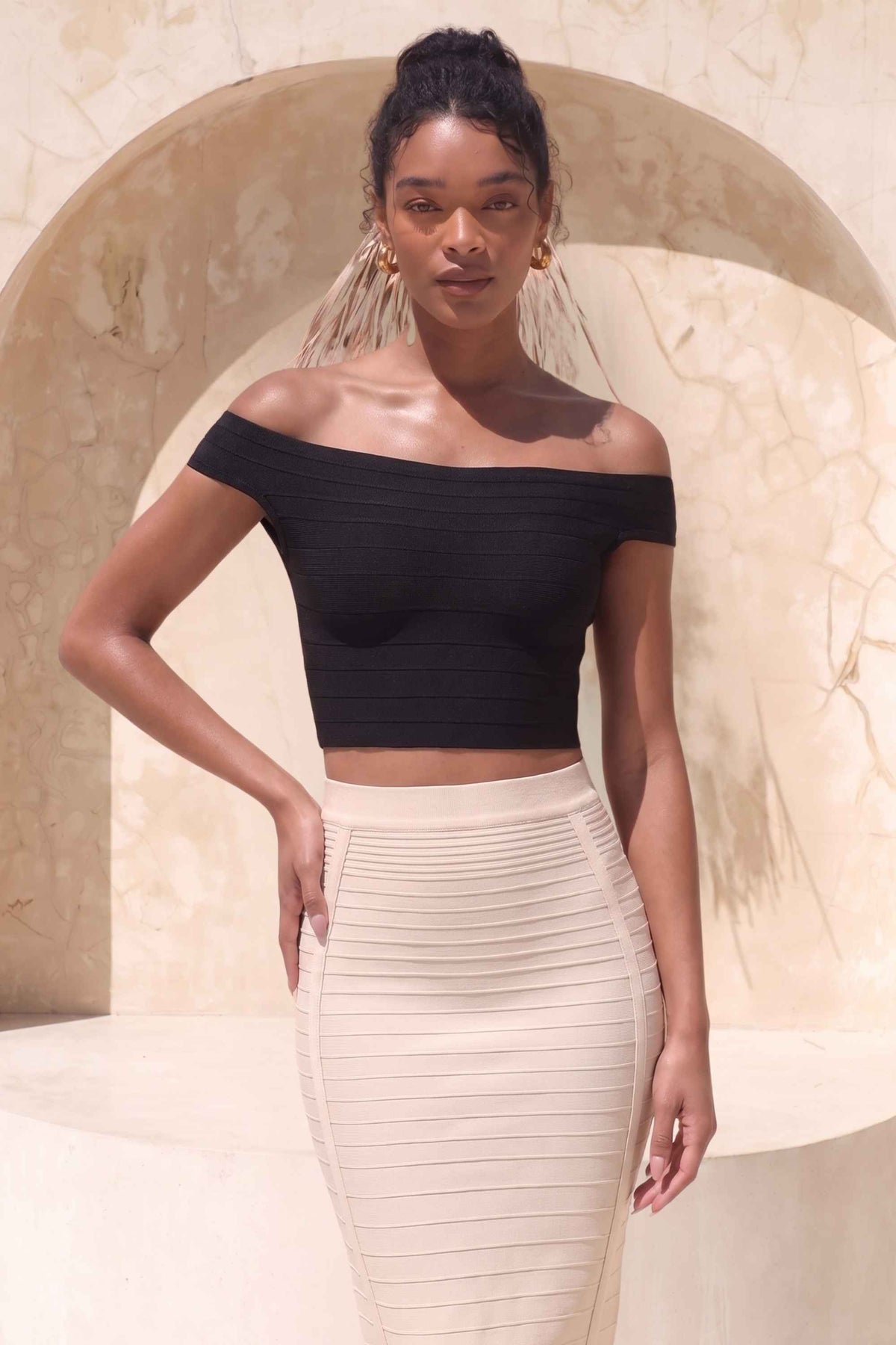 Woman wearing a figure flattering  Pencil High Waist Bandage Knee Length Knitted Skirt - Cream BODYCON COLLECTION