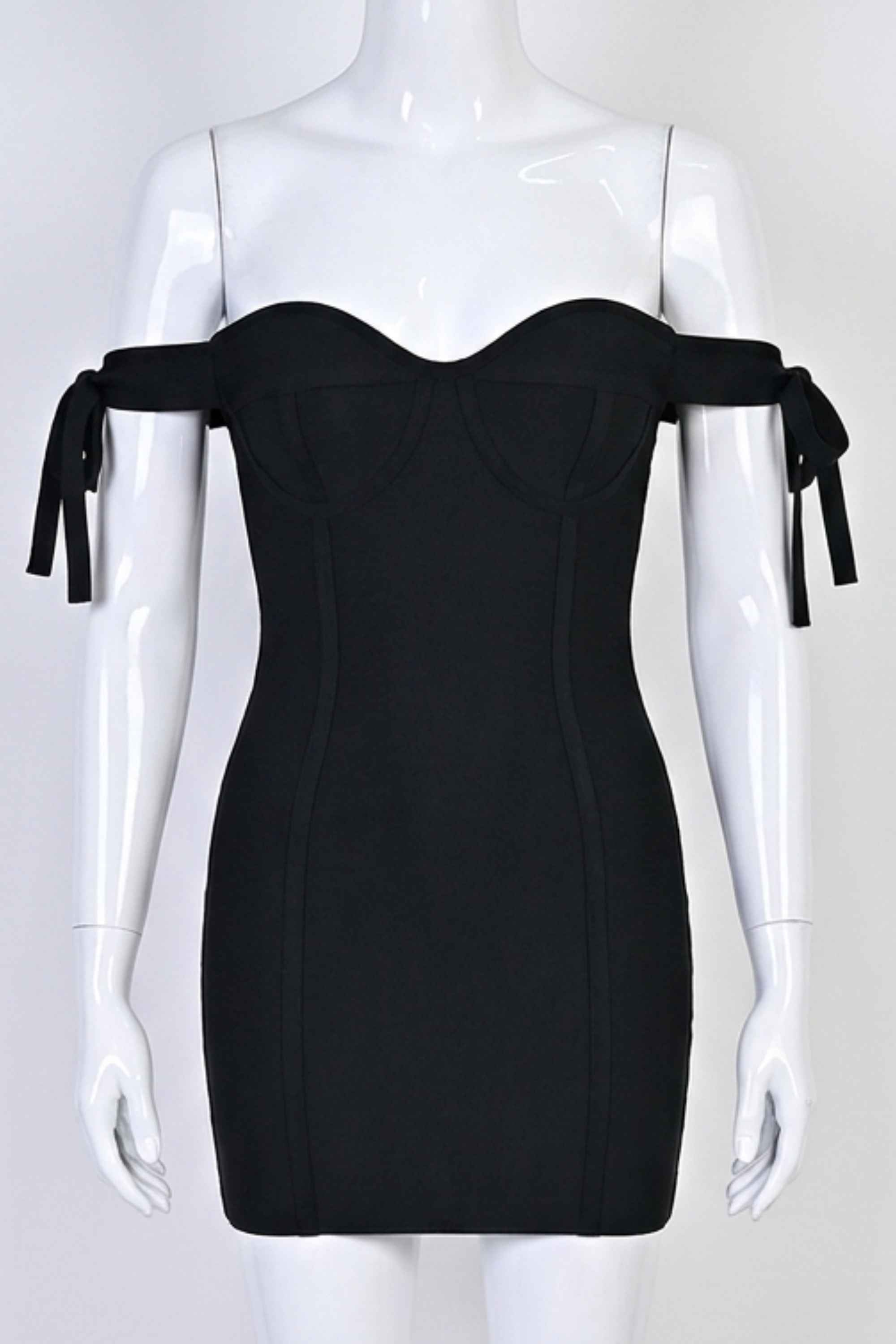 Woman wearing a figure flattering  Penelope Bandage Mini Dress - Classic Black BODYCON COLLECTION