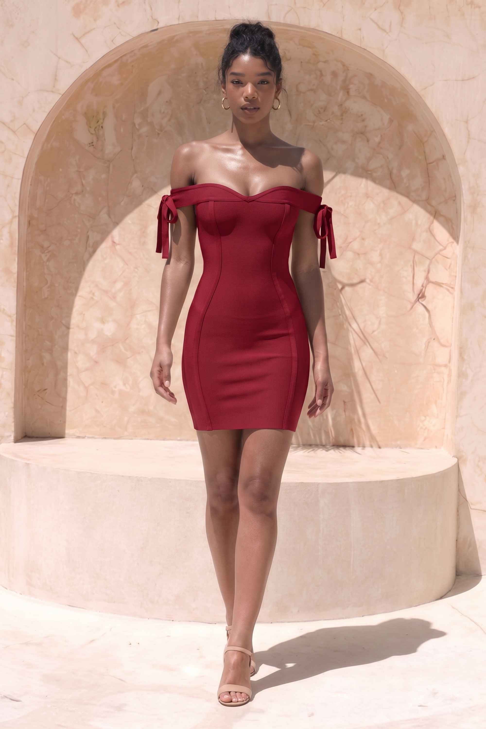 Woman wearing a figure flattering  Penelope Bandage Mini Dress - Red Wine BODYCON COLLECTION