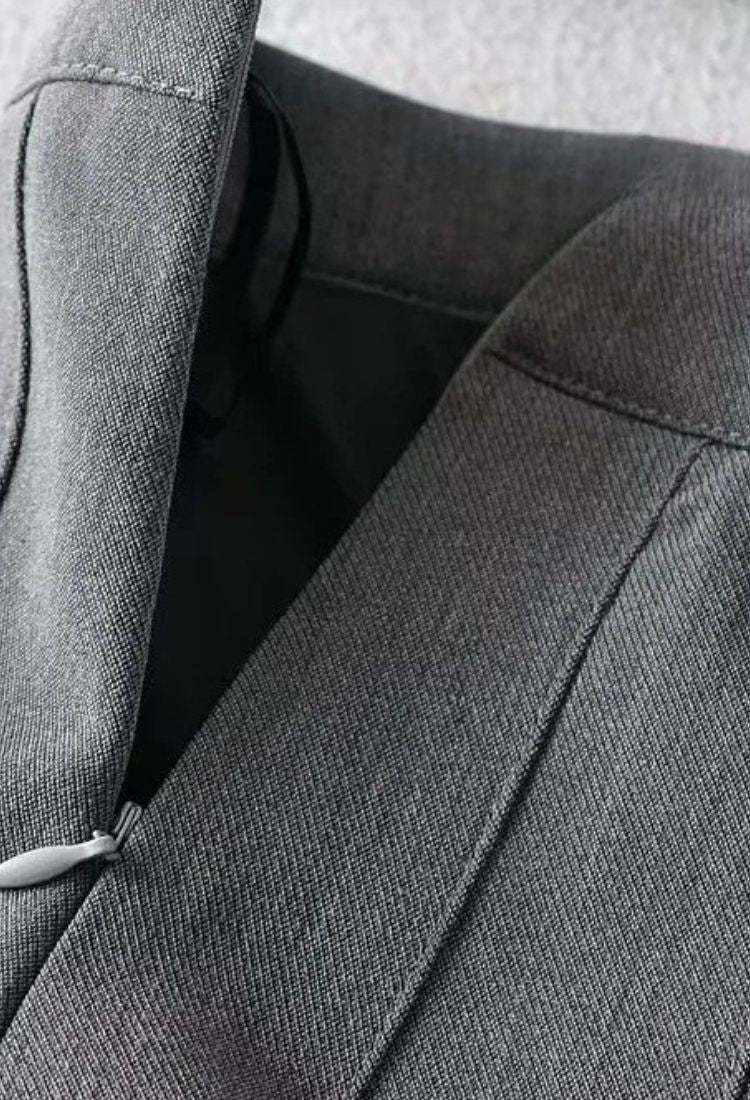 Woman wearing a figure flattering  Pleated Mini Skirt - Grey BODYCON COLLECTION Pty Ltd