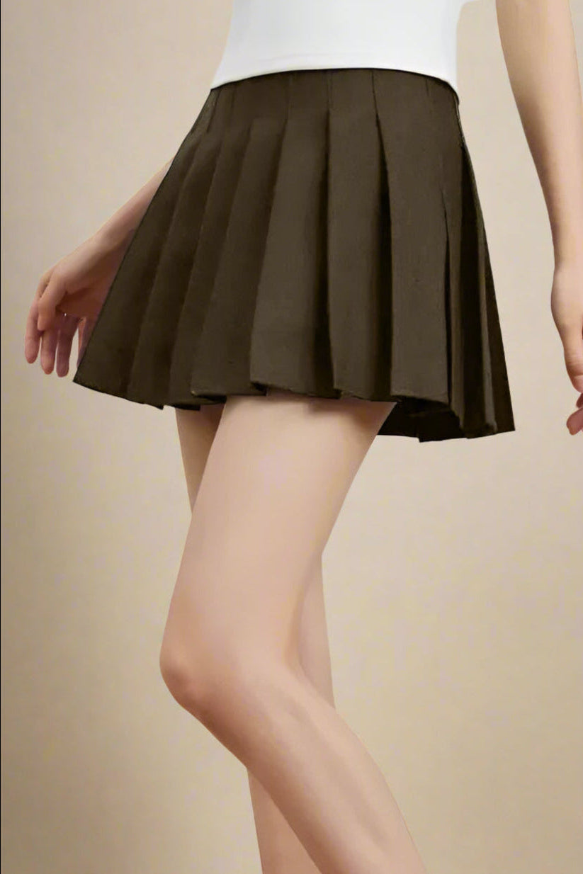 Woman wearing a figure flattering  Pleated Mini Skirt - Tan Brown BODYCON COLLECTION Pty Ltd