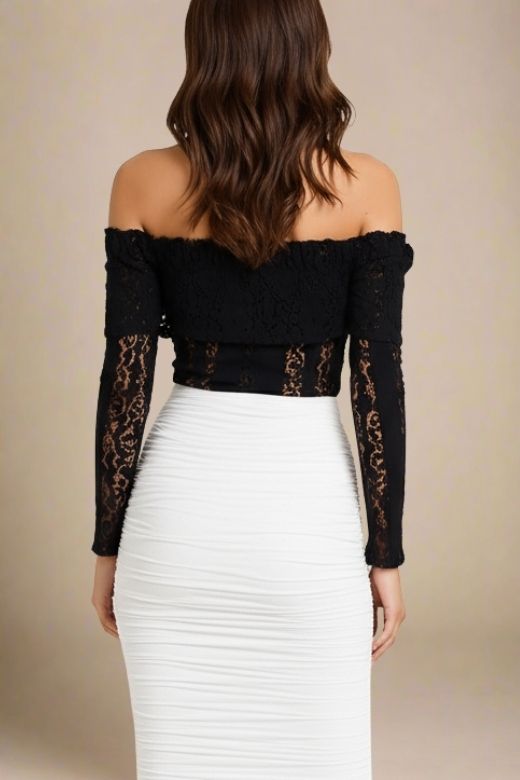 Woman wearing a figure flattering  Rose Long Sleeve Top - Classic Black BODYCON COLLECTION