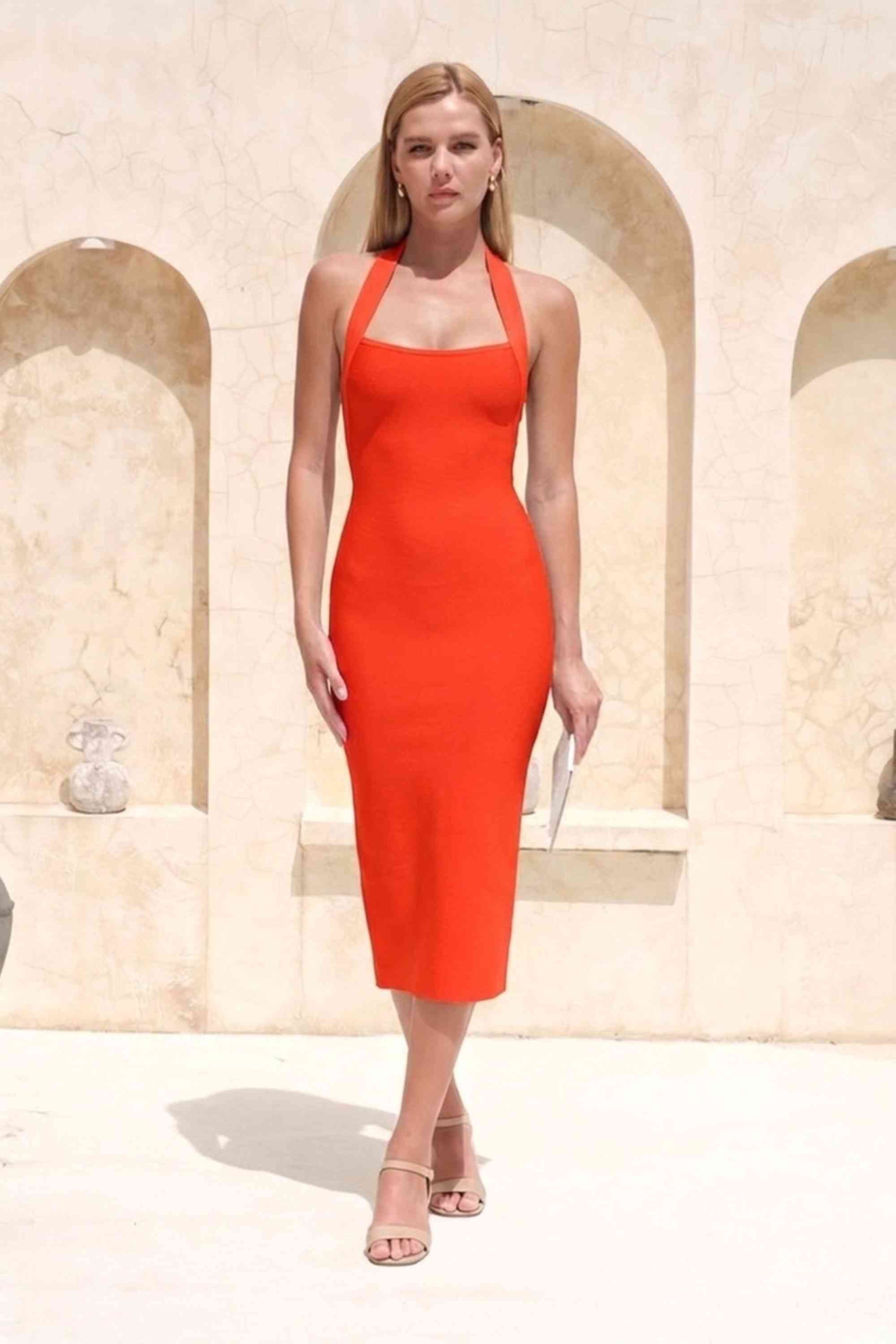 Woman wearing a figure flattering  Raya Bodycon Midi Dress - Lipstick Red BODYCON COLLECTION Pty Ltd