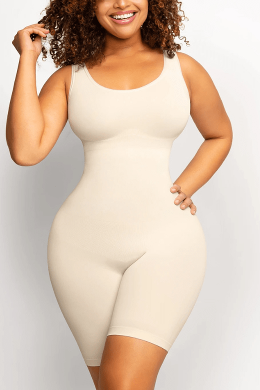 Woman wearing a figure flattering  Round Neck One Piece Bodysuit Shapewear - Mid Thigh Bodycon Collection