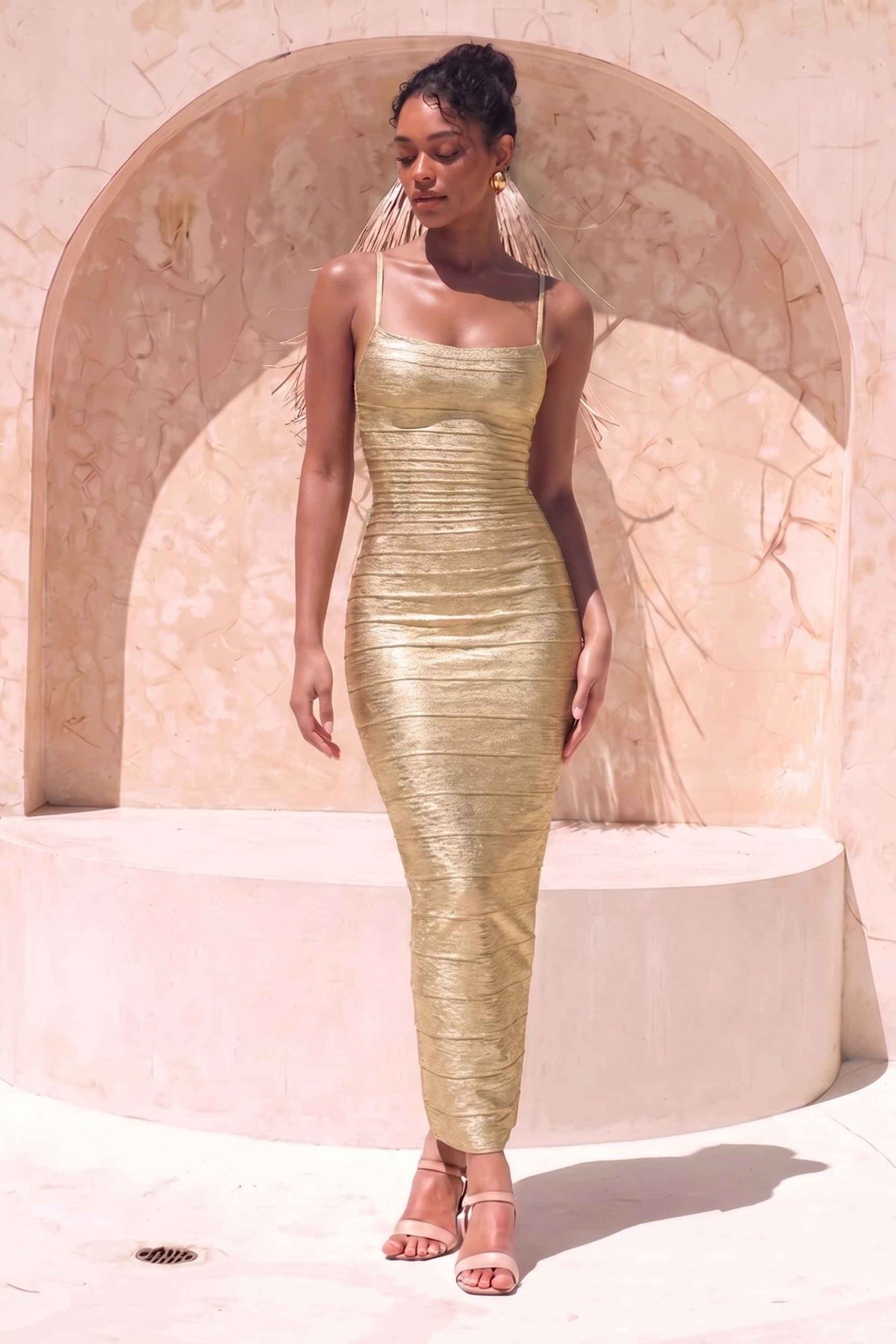 Woman wearing a figure flattering  Scarlett Bandage Maxi Dress - Gold BODYCON COLLECTION Pty Ltd