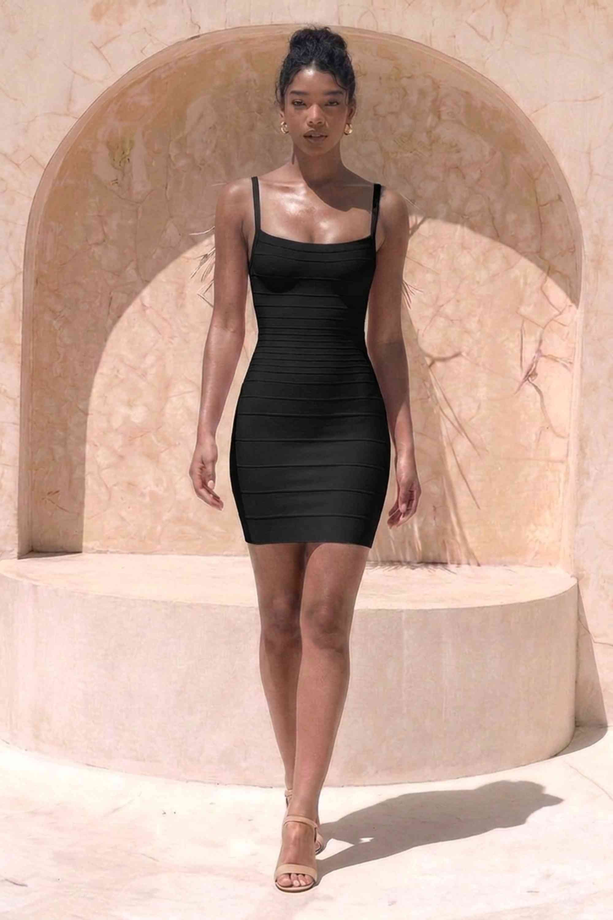 Woman wearing a figure flattering  Scarlett Bandage Mini Dress - Classic Black BODYCON COLLECTION Pty Ltd