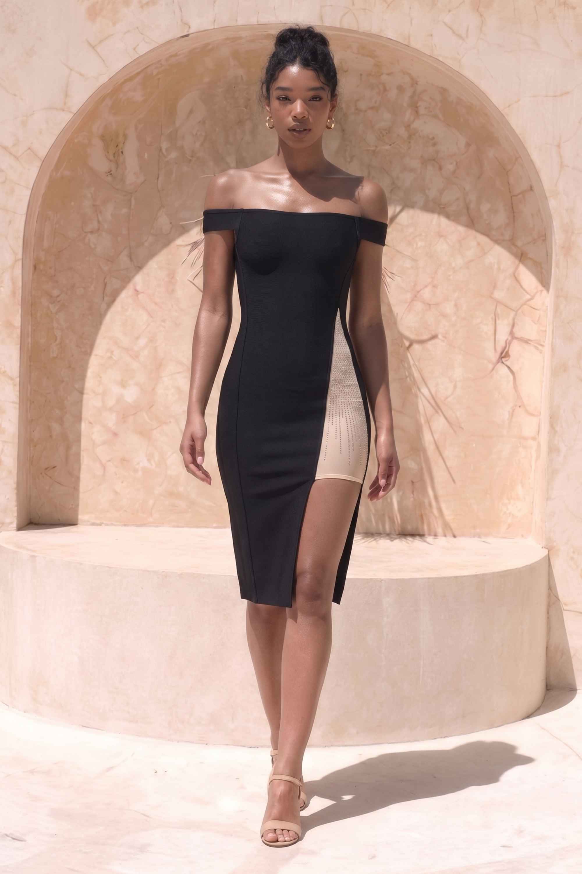 Woman wearing a figure flattering  Sofie Off Shoulder Bodycon Dress - Classic Black BODYCON COLLECTION