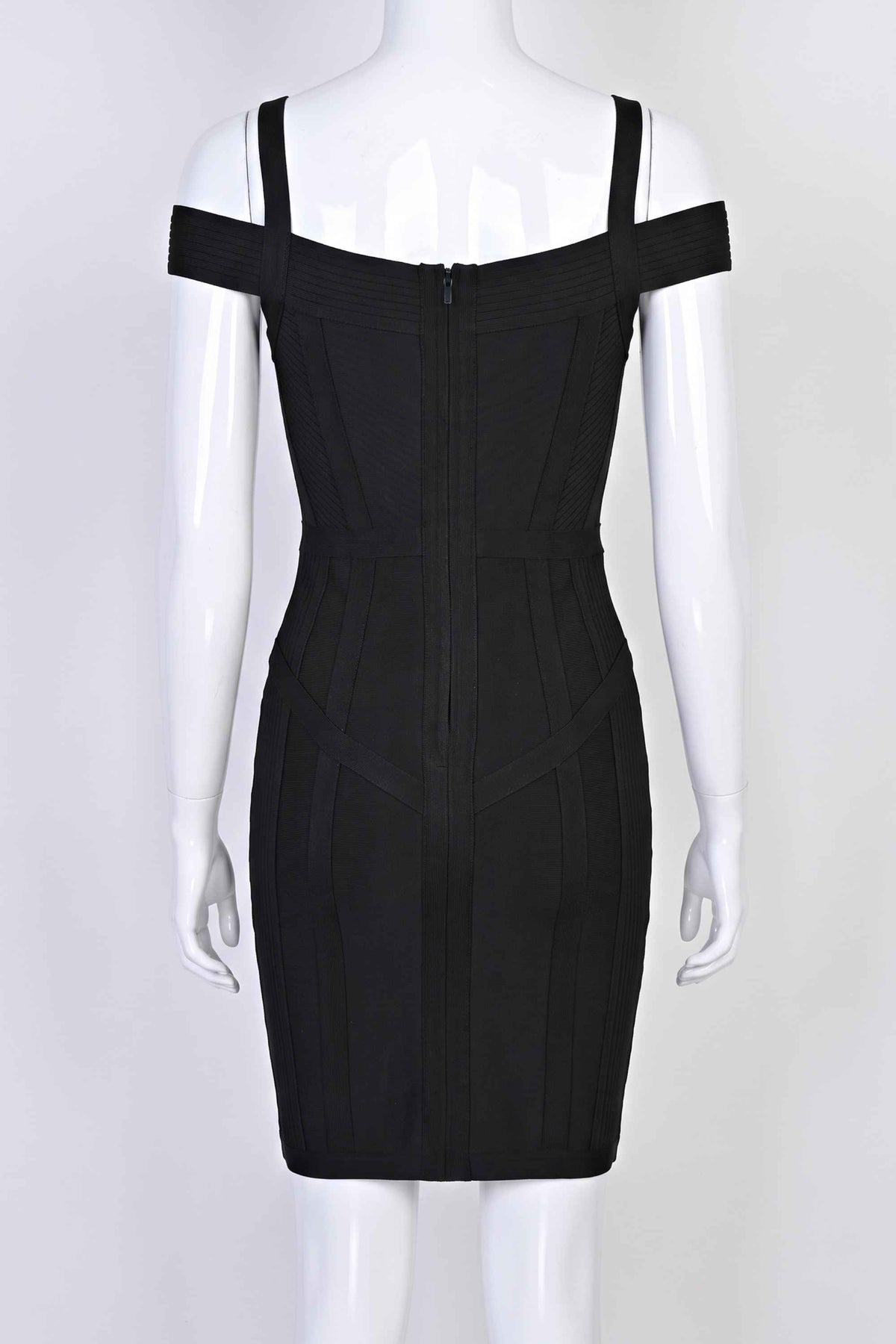 Woman wearing a figure flattering  Sophia Bandage Mini Dress - Classic Black Bodycon Collection