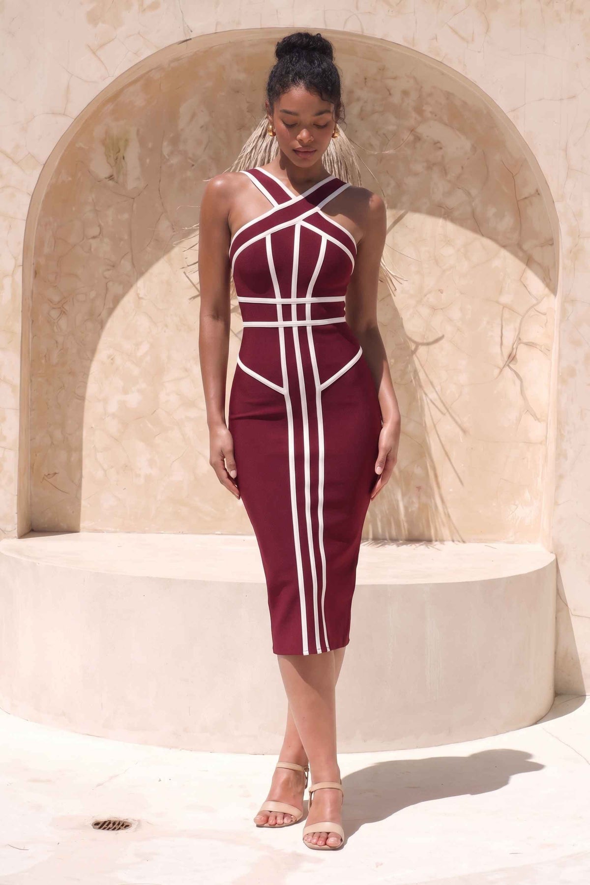 Woman wearing a figure flattering  Suki Bandage Midi Dress - Red Wine BODYCON COLLECTION