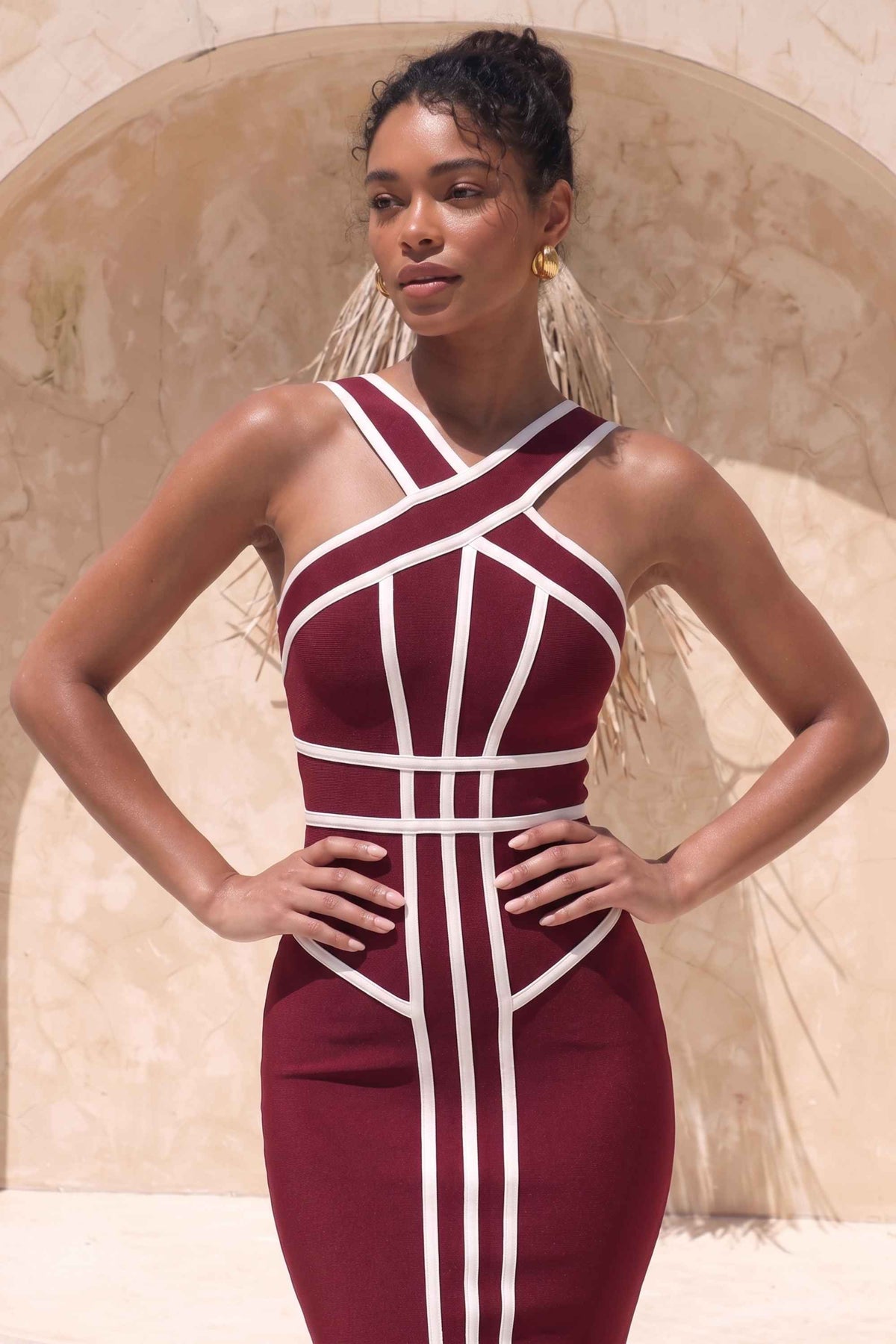 Woman wearing a figure flattering  Suki Bandage Midi Dress - Red Wine BODYCON COLLECTION