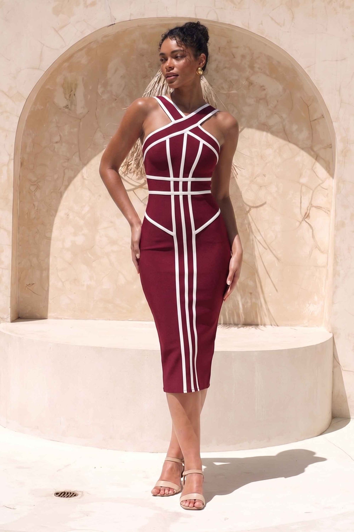 Woman wearing a figure flattering  Suki Bandage Midi Dress - Red Wine BODYCON COLLECTION