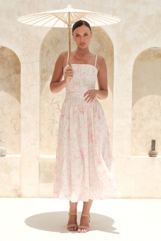 Woman wearing a figure flattering  Tasmin Midi Dress - Pink Print BODYCON COLLECTION