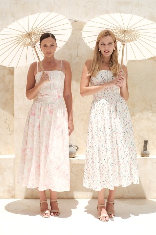 Woman wearing a figure flattering  Tasmin Midi Dress - White Pearl BODYCON COLLECTION